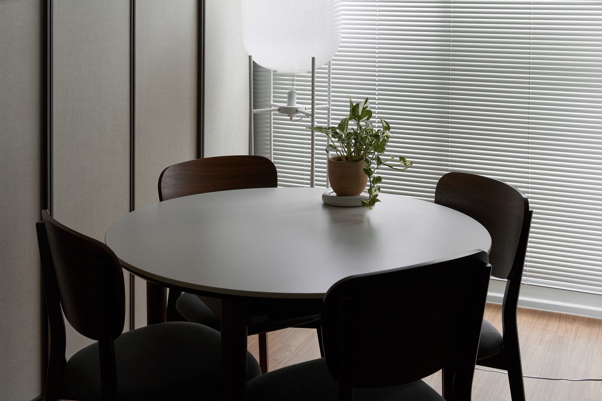 Round dining table and low light beside the window