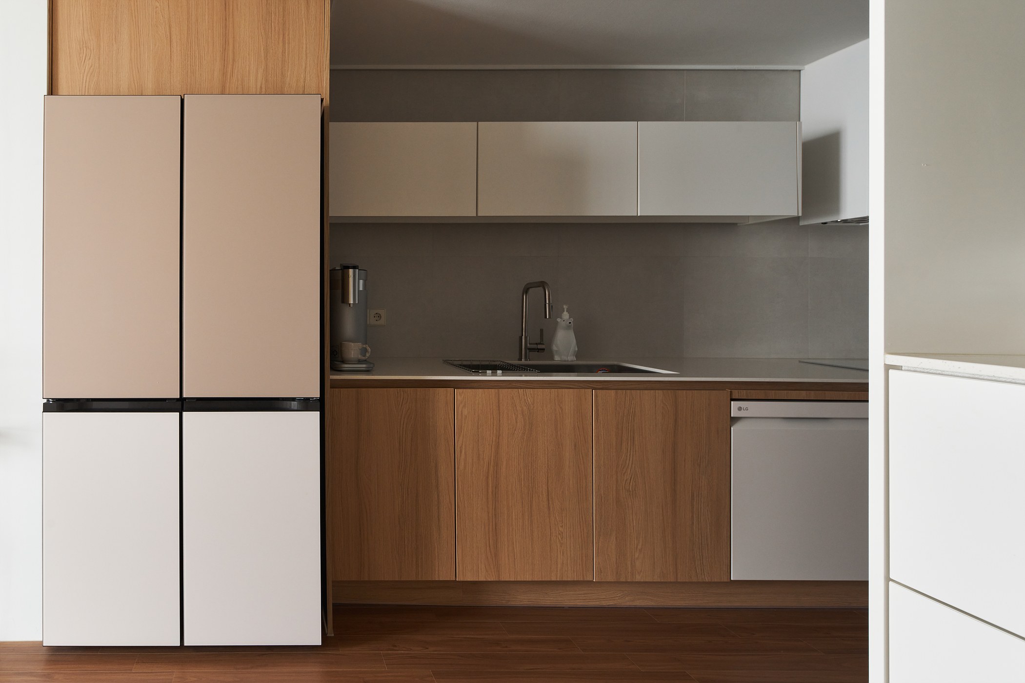 Kitchen elevation where white storage meets warm timber