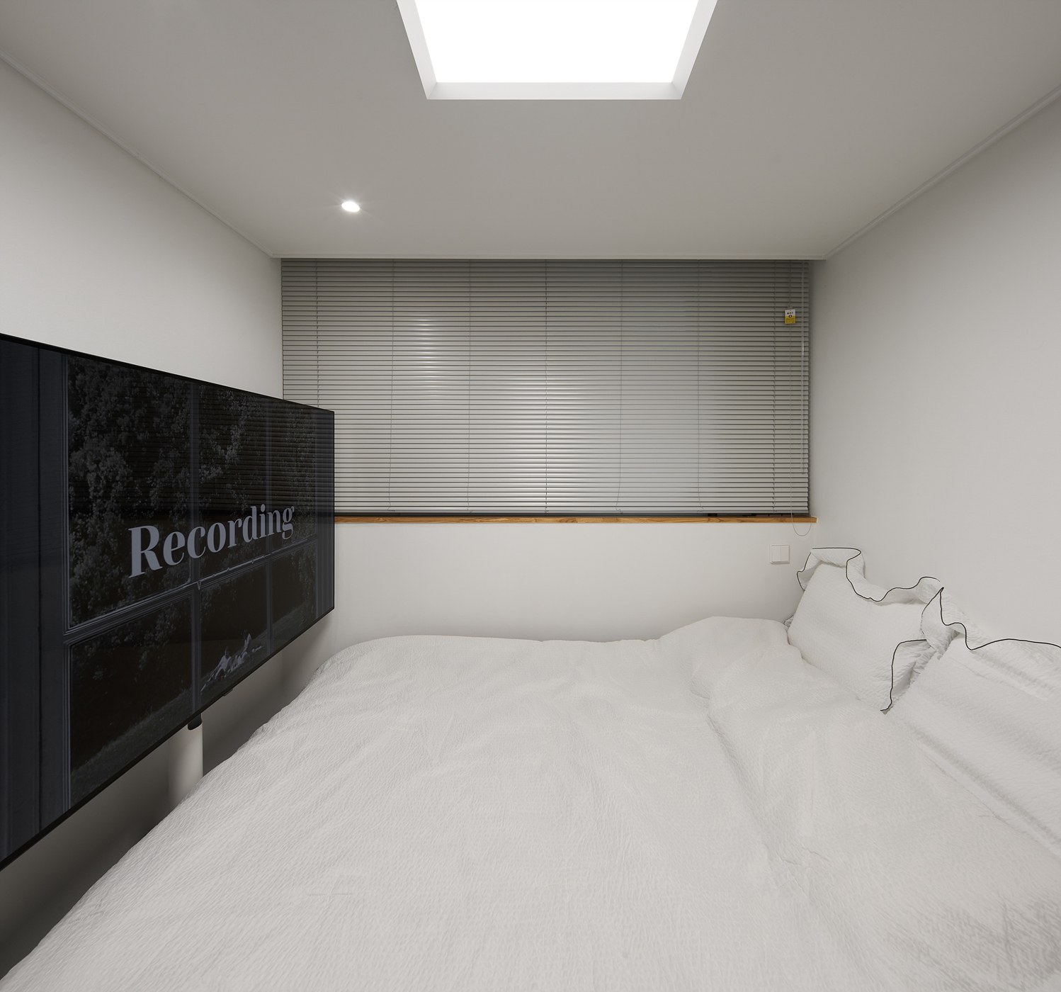 SOW House bedroom cleared by full-height wall storage