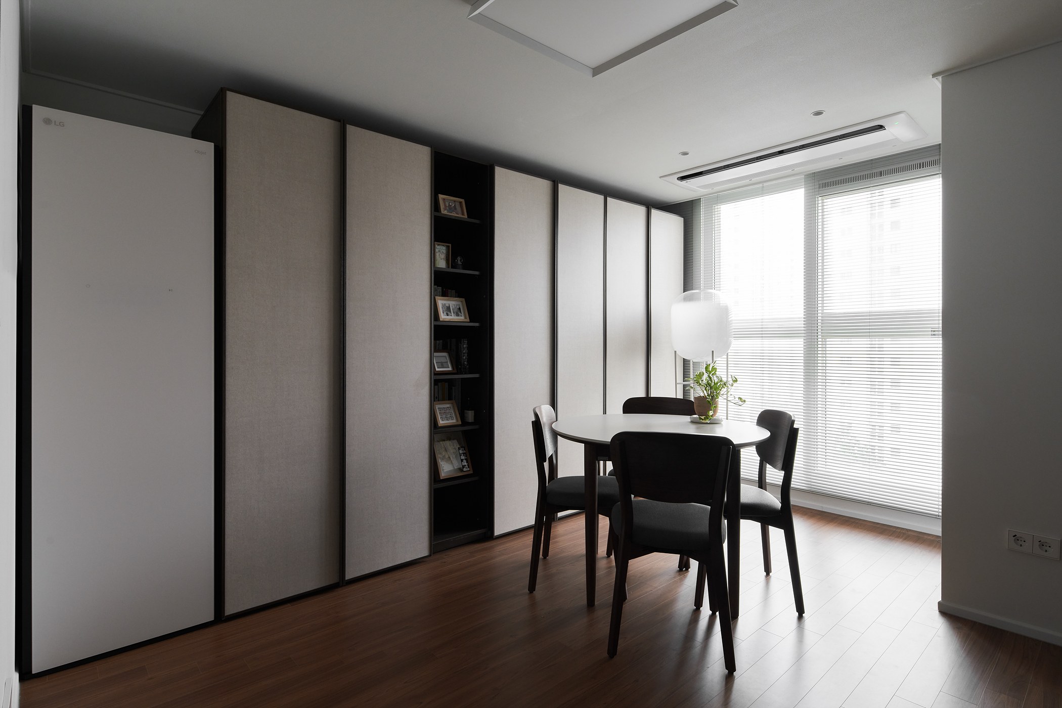 Bright interior connecting sliding storage panels and dining