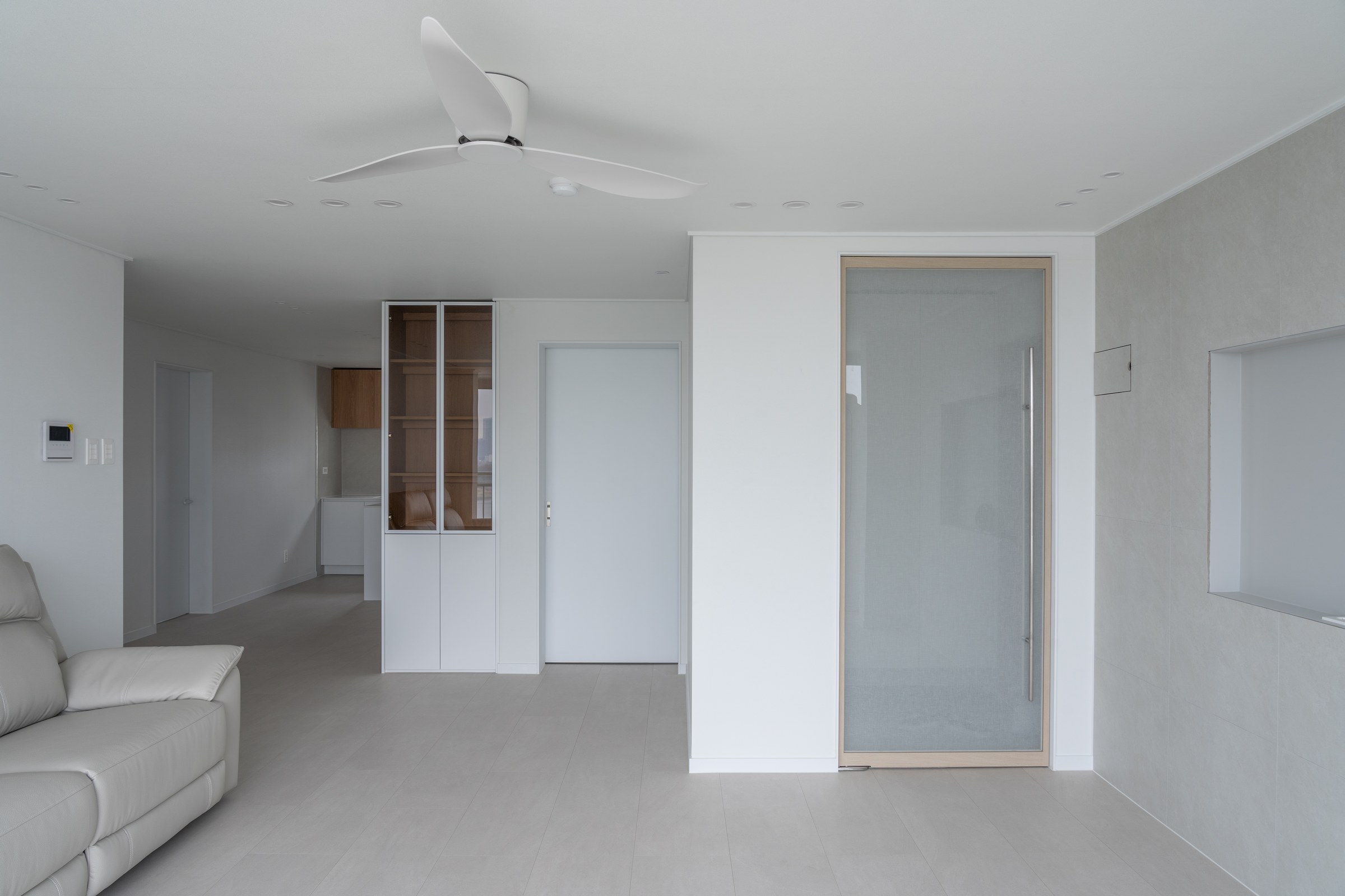 Open domestic space viewed from the living room towards the kitchen